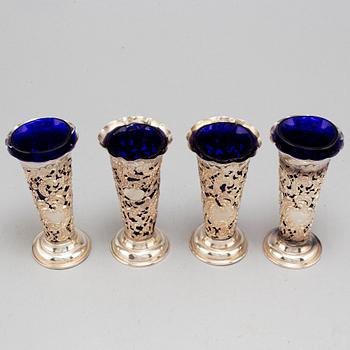 WILLIAM COMYNS, four silver vases, London, England, 1905.