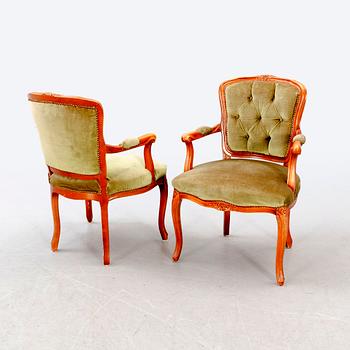 A pair of Rococo-style mid 1900s armchairs.