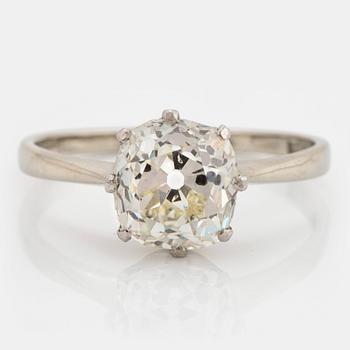 An 18K white gold ring set with a cushion formed old-cut diamond weight ca 2.75 cts quality ca L/M i.