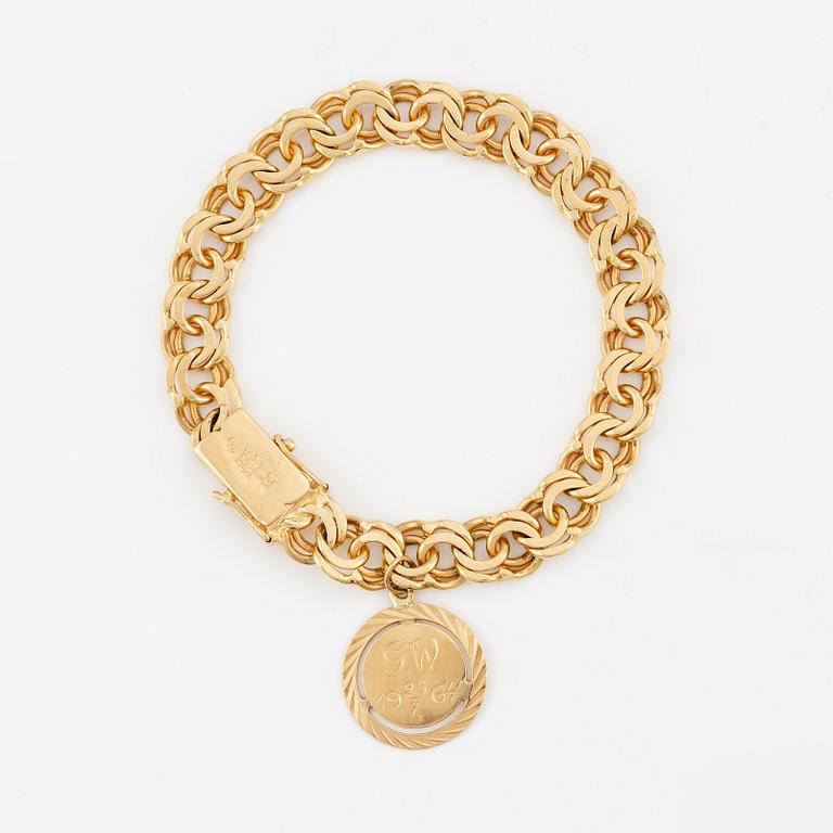 Bracelet, 18K gold Bismarck link, with charm.