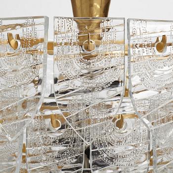 Gunnar Cyrén, GUNNAR CYRÉN, a glass and gilt bronze chandelier, Orrefors, Sweden 1960's.