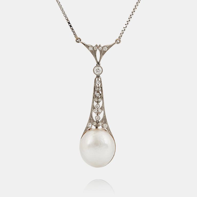 A platinum pendant set with a half pearl and old-cut diamonds.