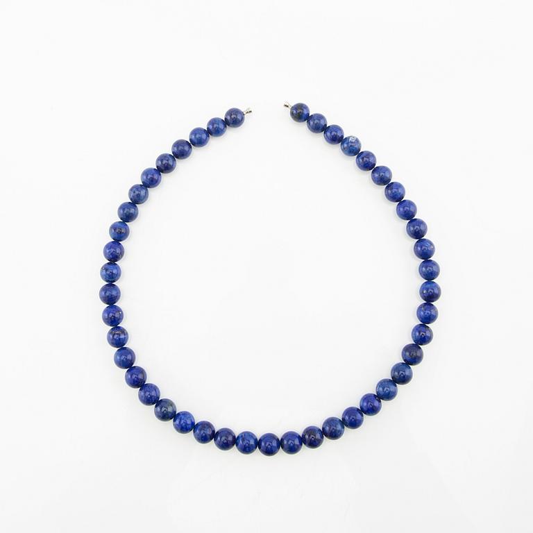 Ole Lynggaard, Necklace clasp in 18K gold with two necklaces of lapis lazuli, clasp design by Charlotte Lynggaard.