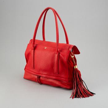 Diane von Fürstenberg a red leather handbag and wallet.