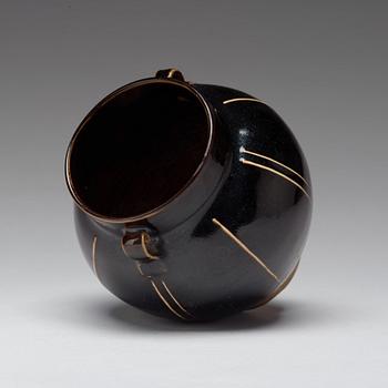 A Henan black glazed ribbed jar, Song dynasty (960-1279).