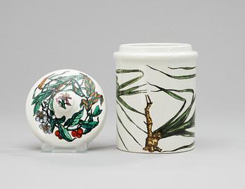 A Fornasetti porcelaine jar with lid.