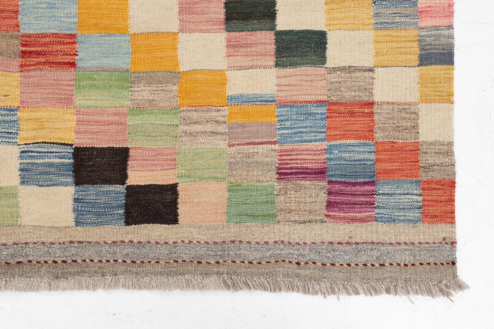 A Kelim carpet, c. 253 x 182 cm.