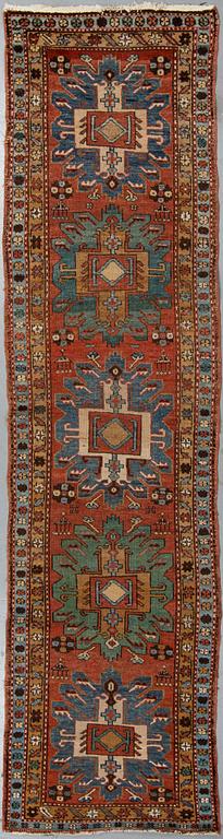 A Heriz runner, ca 310 x 85 cm.