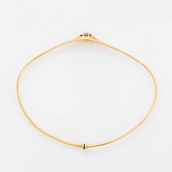 ARMRING, guld med gammalslipad diamant.