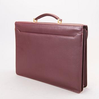 A Cartier leather briefcase.
