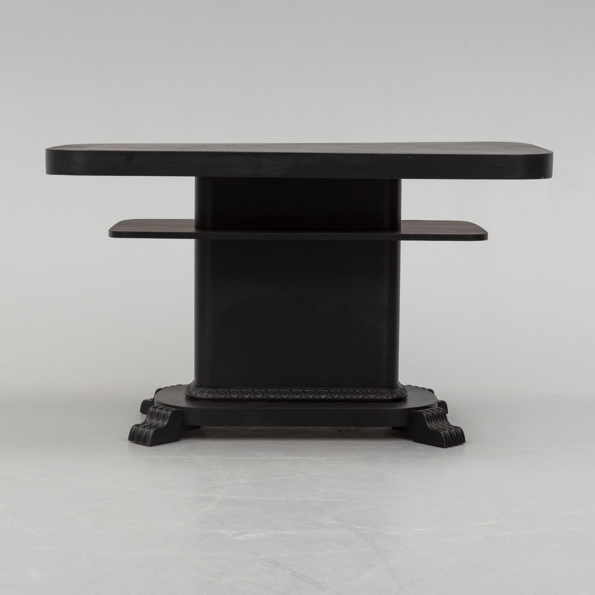 a coffee table from the first half of the 20th century.