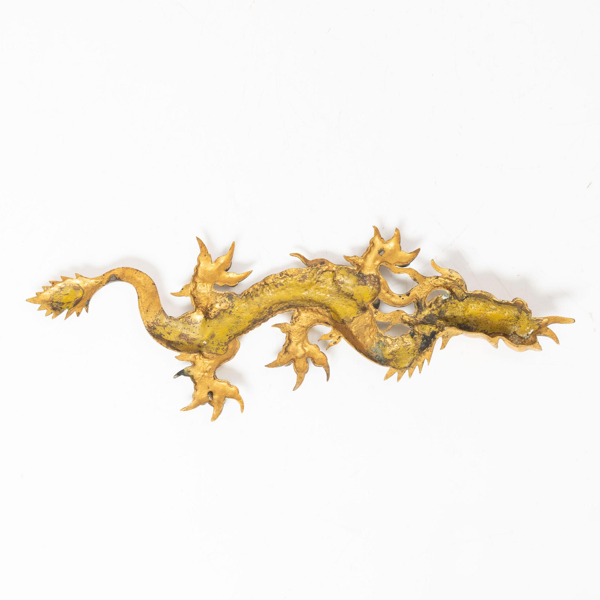 A Chinese bronze dragon fitting, late Qing dynasty.