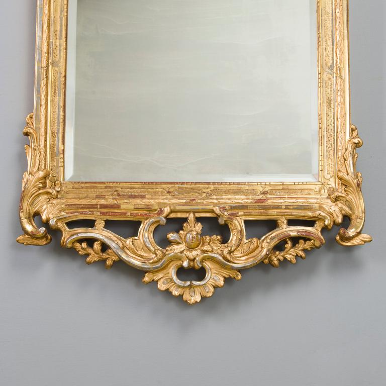 Johan Åkerblad, a giltwood Rococo mirror, signed and dated in Stockholm 1776.