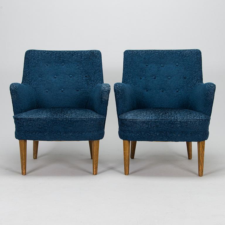 A pair of mid-20th-century armchairs.