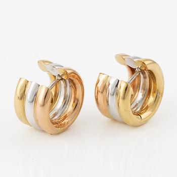 A pair of earrings in 18K gold in three colours.