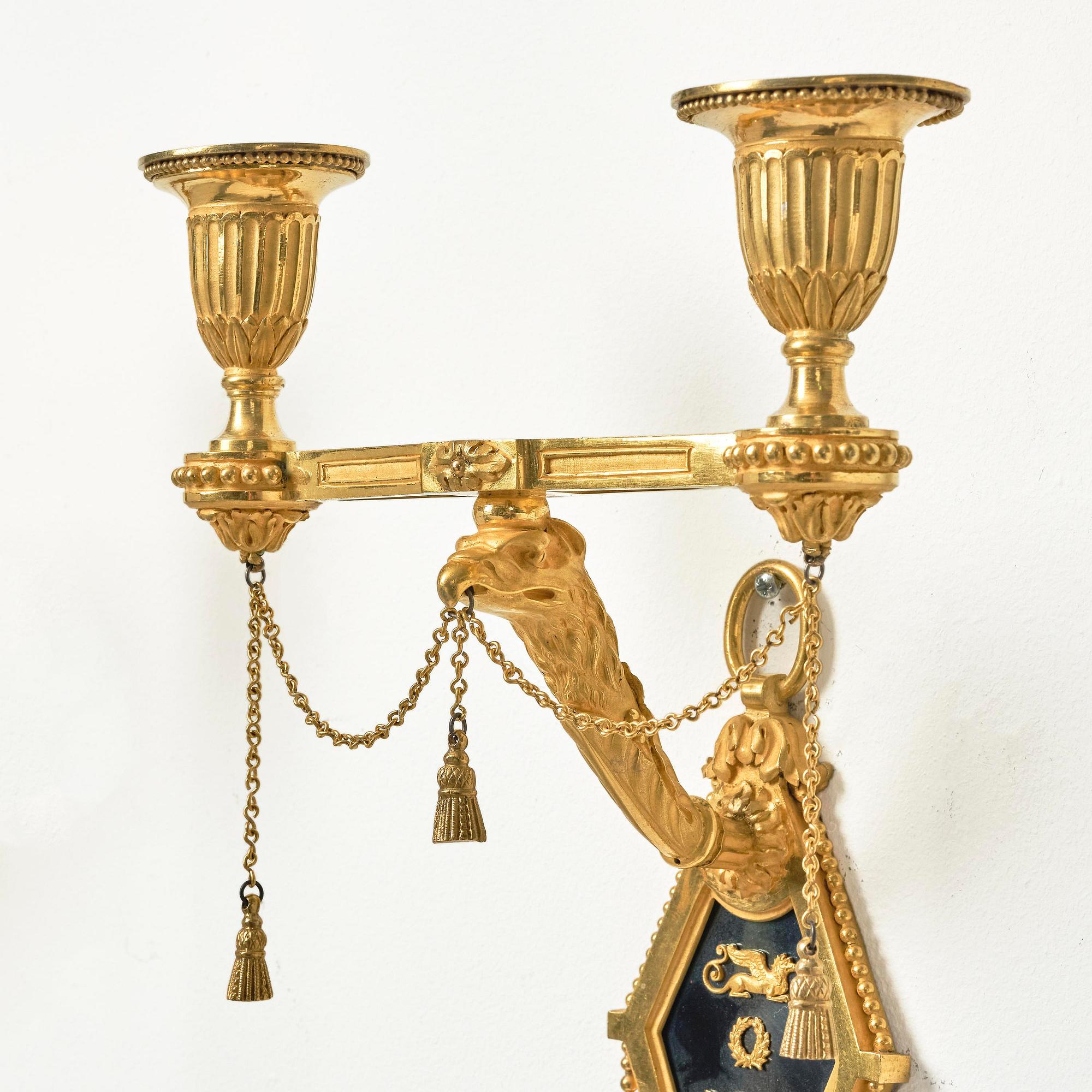A pair of two-branch late Louis XVI ormolu and blued steel appliques attr. to F. Rémond (bronzier in Paris 1774-1812).