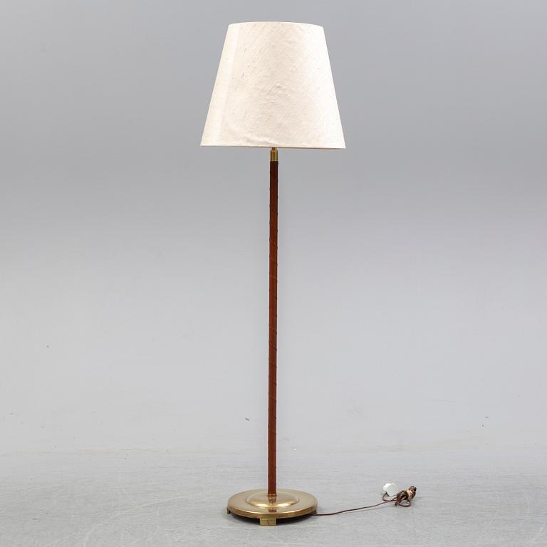 A brass and leather floor lamp model '32753', Nordiska Kompaniet 1940's.
