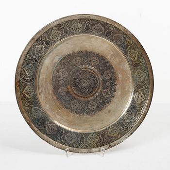 A pair of Persian silver plates, 20th century.