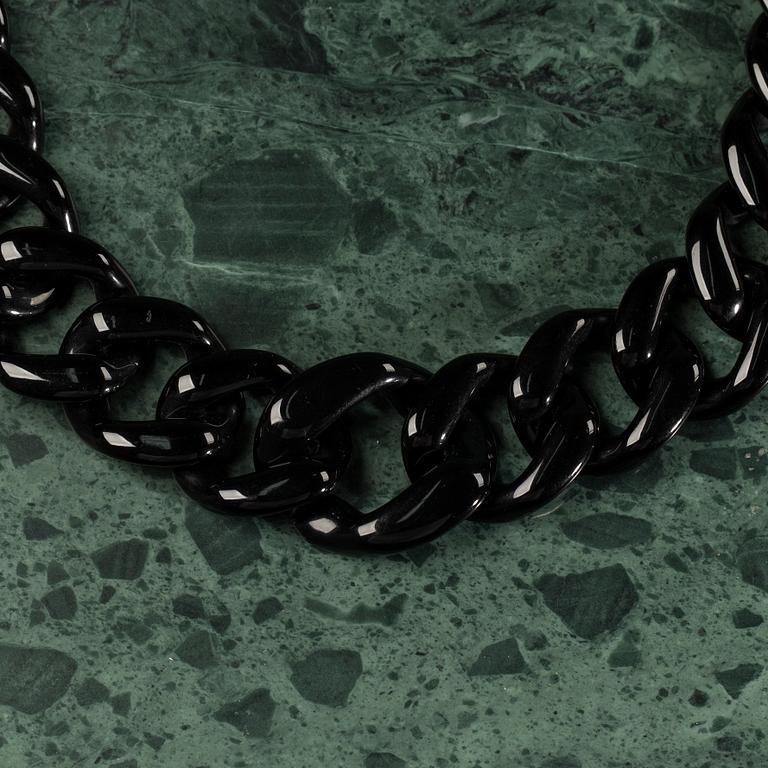 A necklace by PRADA.