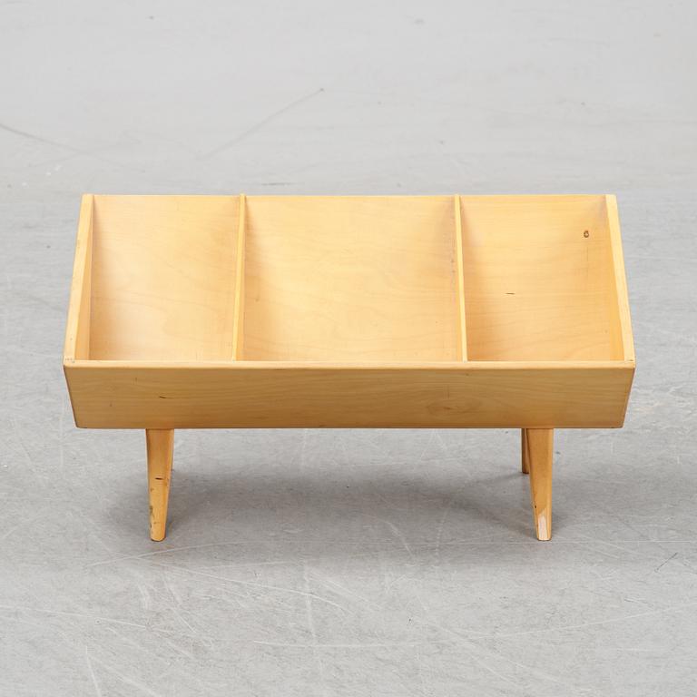 A model T 709 book stand by Bruno Mathsson for Firma Karl Mathsson, dated 1967.