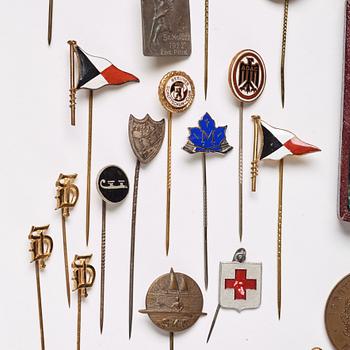 A collection of club pins/club badges for various associations/awards, including Sweden, Germany, and France.