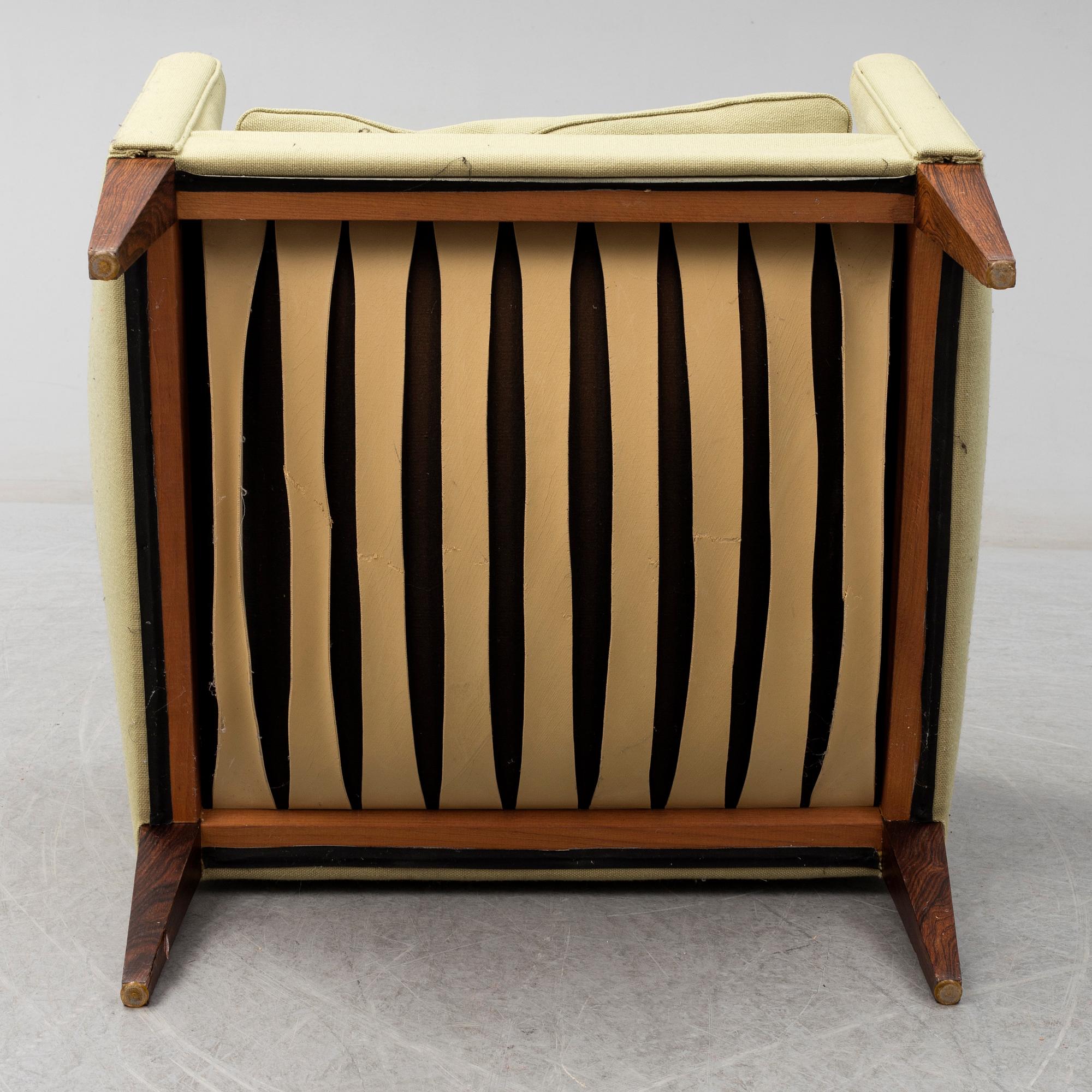 A model V 12 easy chair by Illum Wikkelsö, manufactured by Holger ...