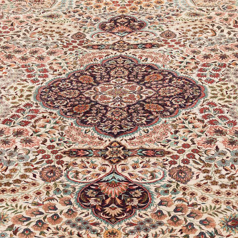 An orietal silk carpet, around 273 x 180 cm.