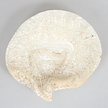 A carved mother-of-pearl shell, late Qing dynasty.