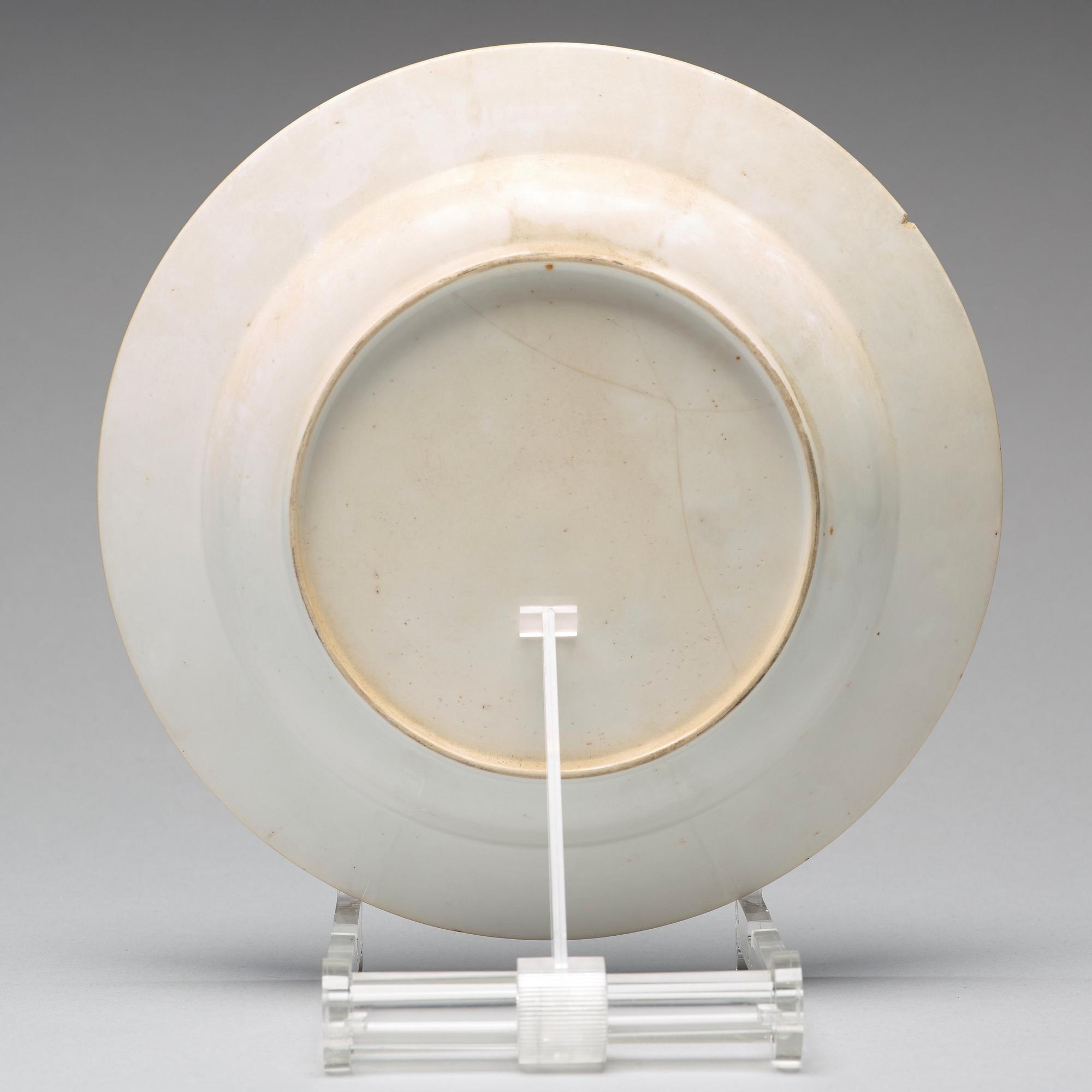 A set of eight blue and white armorial soup dishes, Qing dynasty, 18th Century.