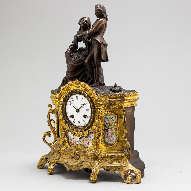 A Rococo style mantle clock, circa 1900.