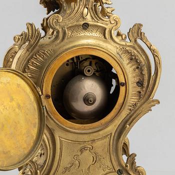 A Rococo Revival mantel clock, late 19th Century.