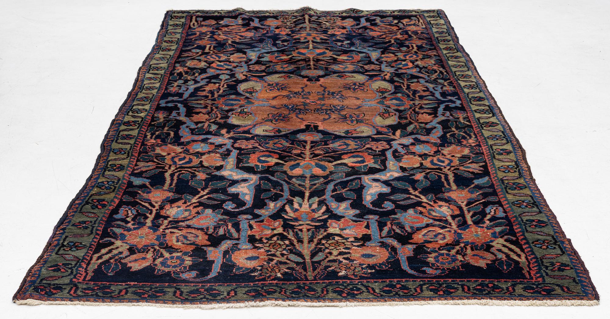 An antique Hamadan, c. 315 x 155 cm.