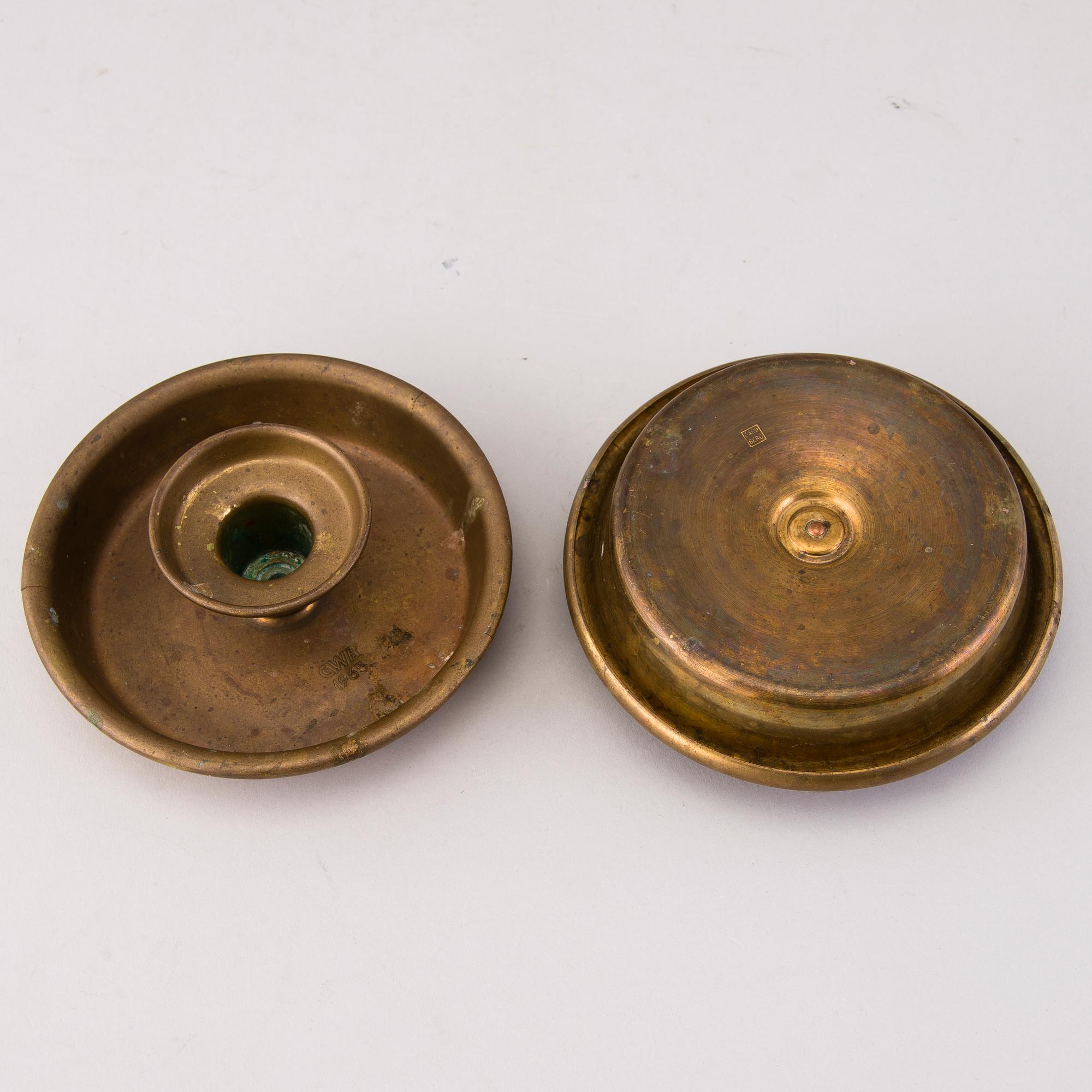 BERTEL GARDBERG, A pair of candleholders in brass, marked Gardberg.