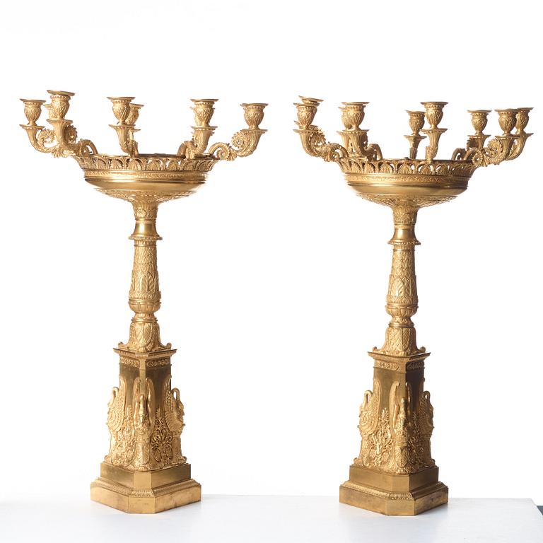 A pair of Empire nine-light candelabra in the manner of Pierre-Phillipe Thomire.