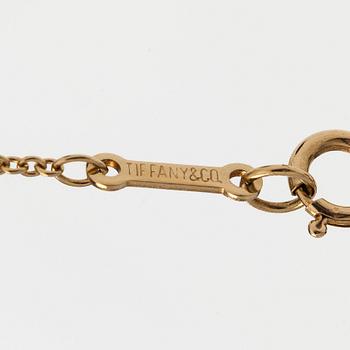 Tiffany & Co, Paloma Picasso, an 18K gold "Loving Heart" necklace.