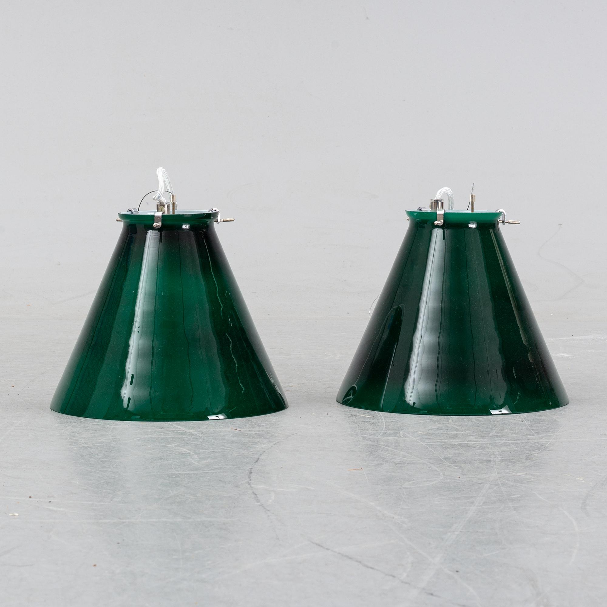A pair of ceiling lamps in green and white glass, model no 4011, Zero.