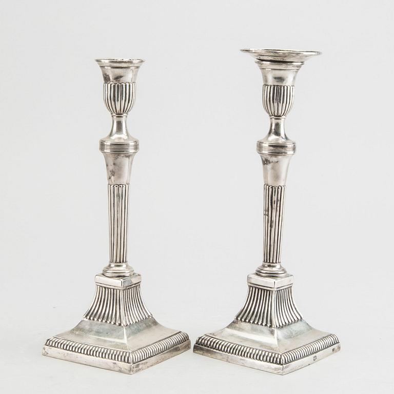 A pair of silver candle sticks around 1800 possibly Portugal, weight ca 734 gr, height ca 23 cm.