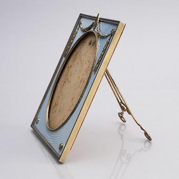 A Fabergé parcel-gilt silver and enamel frame, workmaster Antti Nevalainen, St Petersburg 1899-1908.