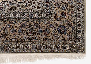 A semi-antique silk Keshan carpet, c. 350 x 248 cm.