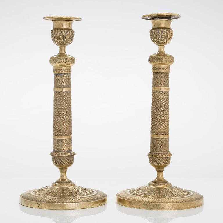 A pair of Empire style candlesticks, around 1900.