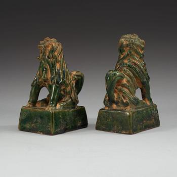 A pair of green glazed joss stick holders, Ming dynasty (1368-1644).