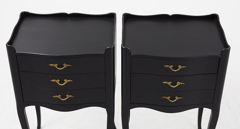 A pair of painted Rococo style bedside tables, second half of the 20th Century.