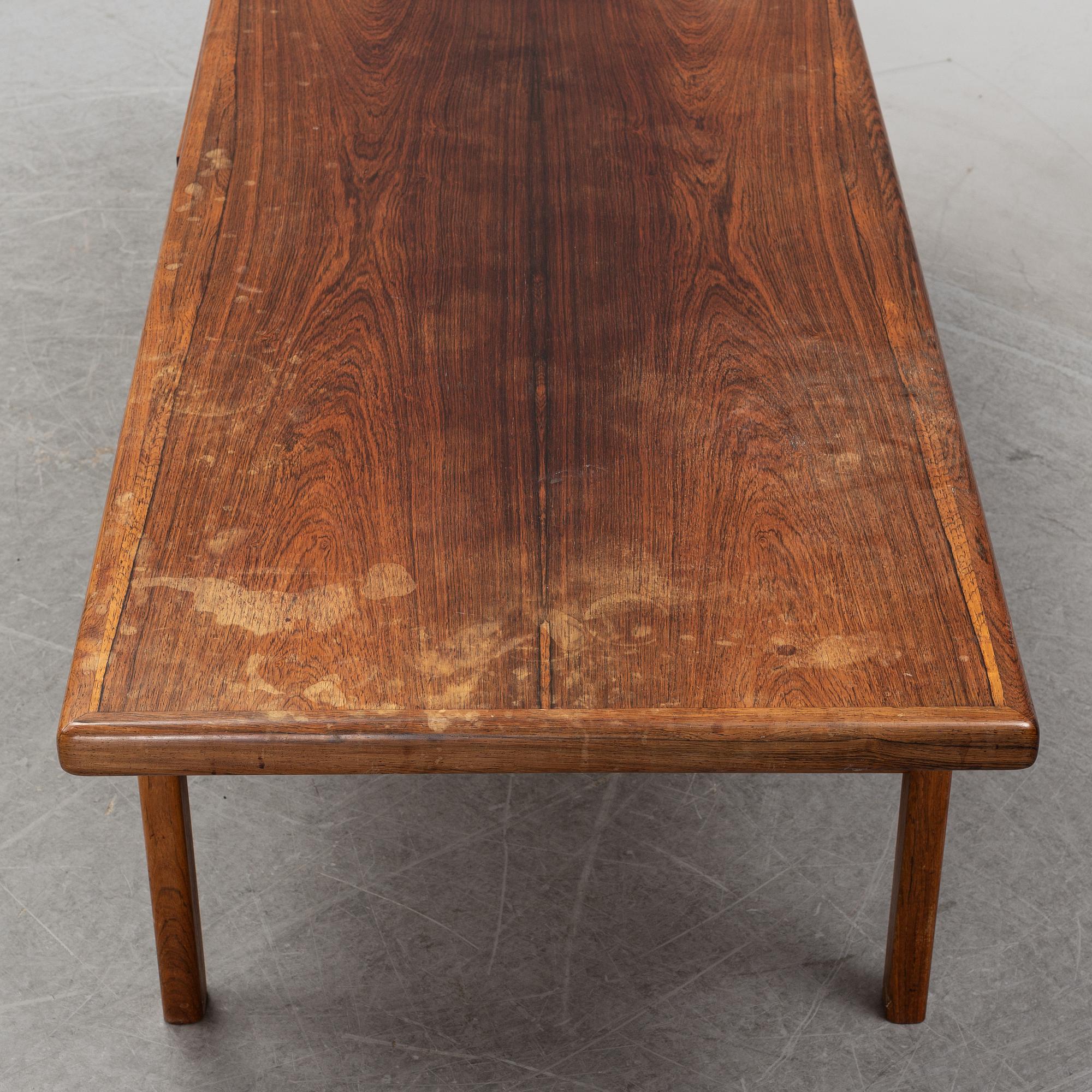 A 1950's/60's rosewood veneered coffee table.