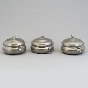 A set of three tin PORRIDGE BOWLS, 19th century.