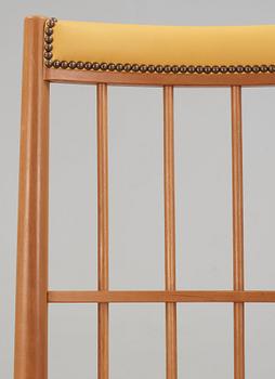A Josef Frank cherry and yellow leather armchair, Svenskt Tenn, model 652.