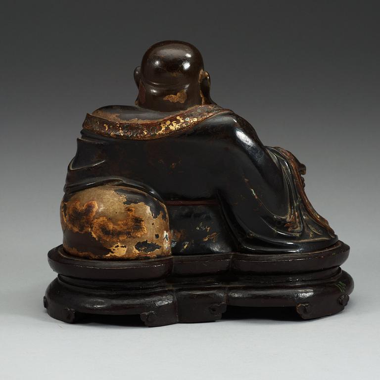 A lacquered bronze figure of Budai, Qing dynasty (1644-1912).