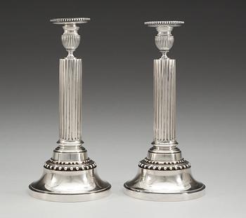 A pair of Swedish 19th cent silver candlesticks, makers mark of Gustaf Möllenborg, Sthlm 1895 and J.E. Torsk, Sthlm 1893.