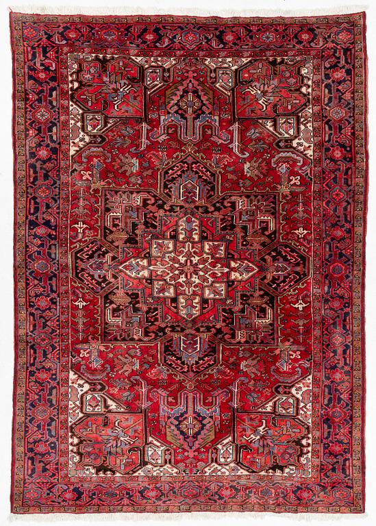 A Heris carpet, c. 345 x 245 cm.