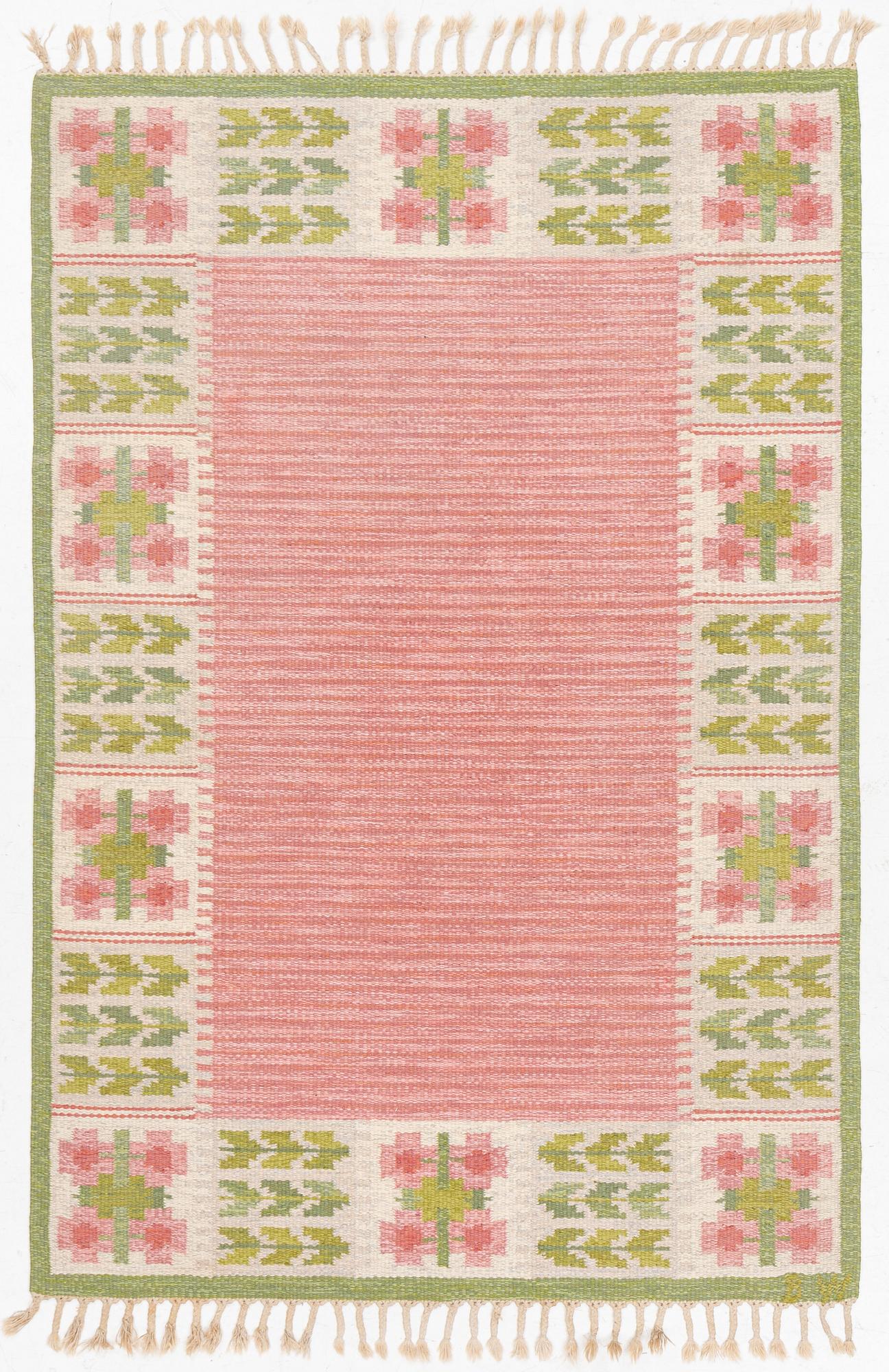 Berit Woelfer, a 'flora' flat weave rug, c. 203 x 136 cm, signed BW.