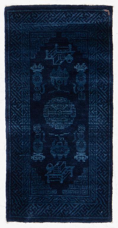 An antique Baotou, rug north China, c. 140 x 70 cm.